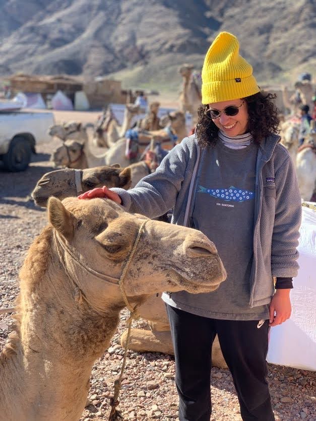 Emma with camel in desert